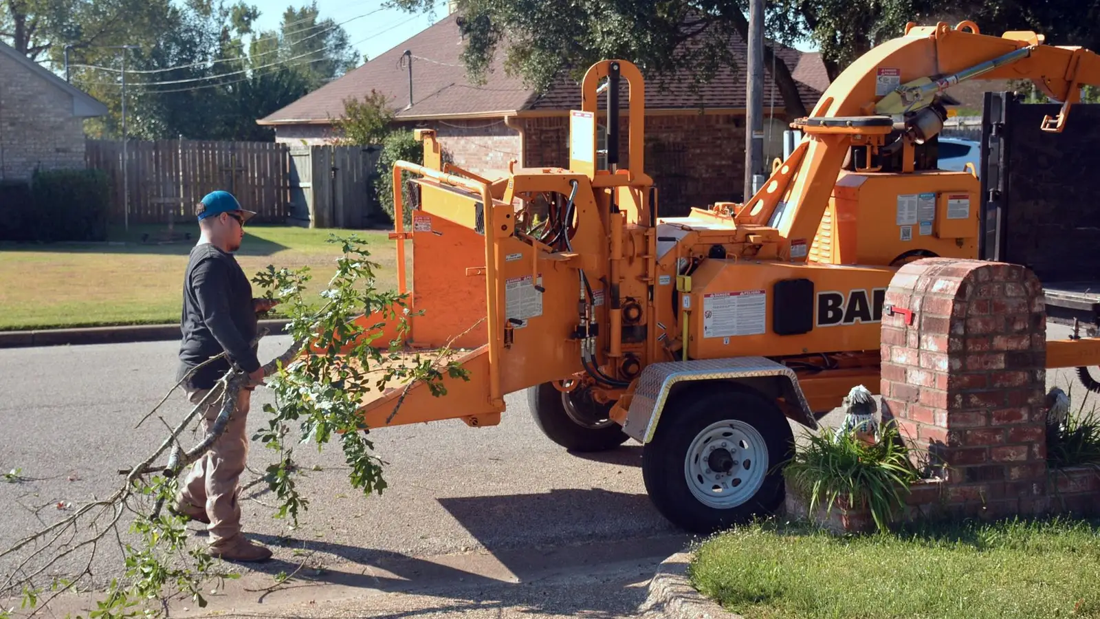 Branches being fed into a wood chipper